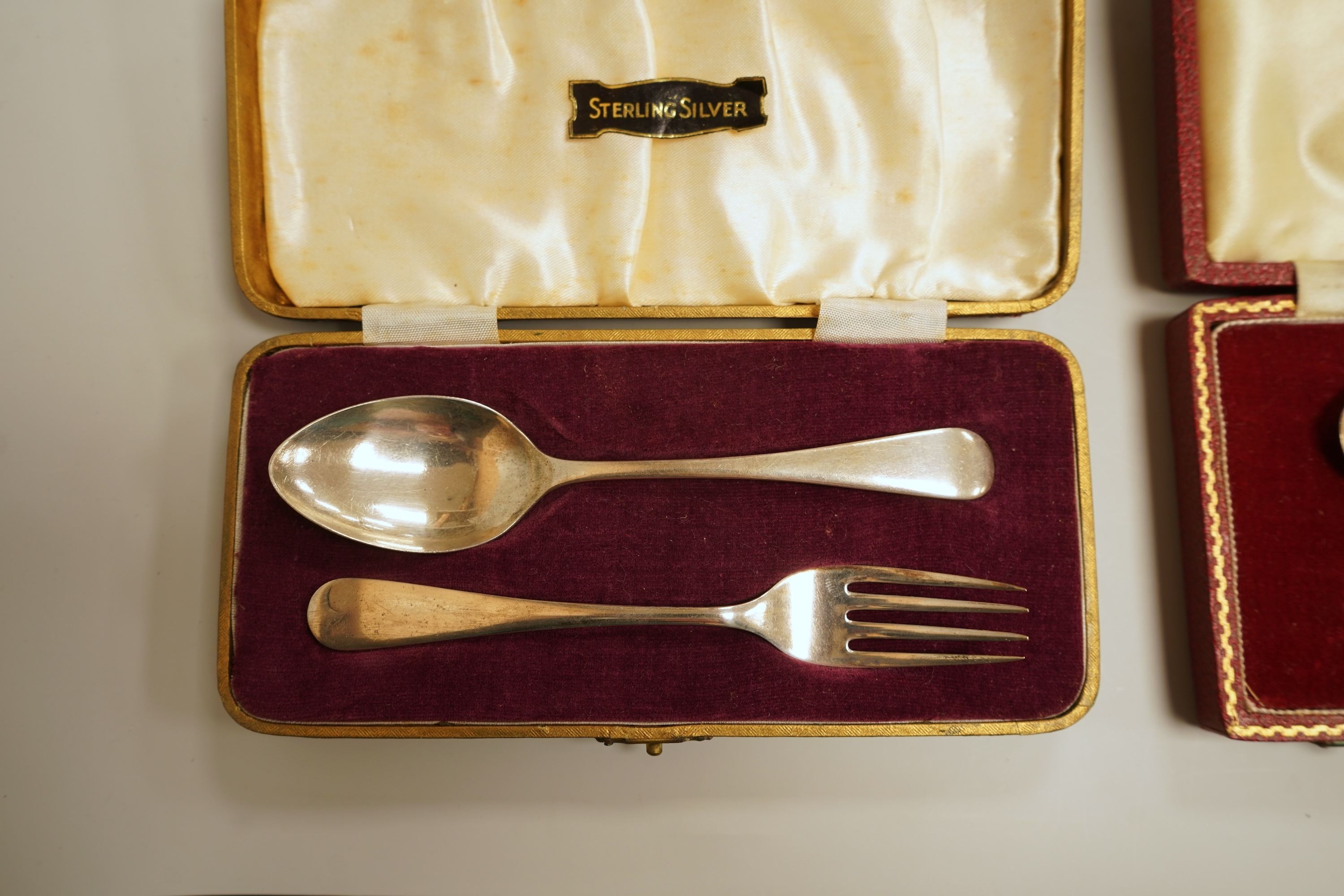 A cased set of six late Victorian silver teaspoons and matching sugar tongs, Miller Bros. Birmingham, 1900, together with three cased silver christening pairs.